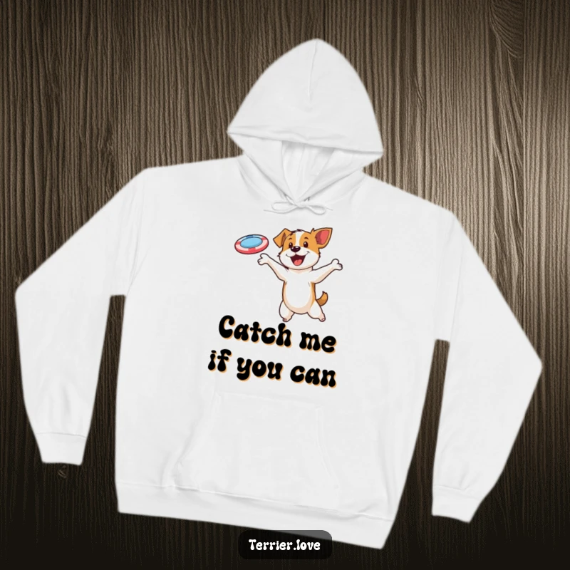 Funny hoodie showcasing a determined terrier gracefully leaping to catch a flying disc, radiating energy and fun.