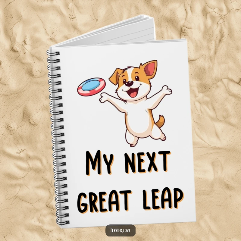Funny notebook with a determined terrier character leaping to catch a flying disc, symbolizing focus and ambition.
