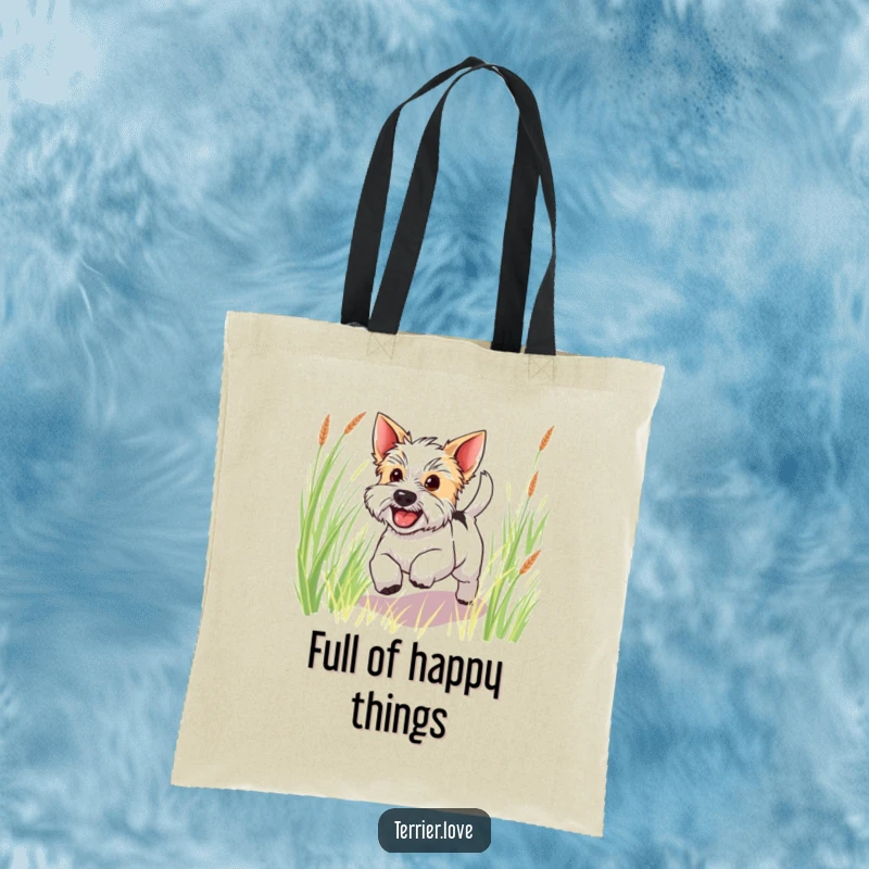 Funny happy terrier tote bag showing a dog with its tail wagging, happily bounding through tall green grass, a joyful sight.